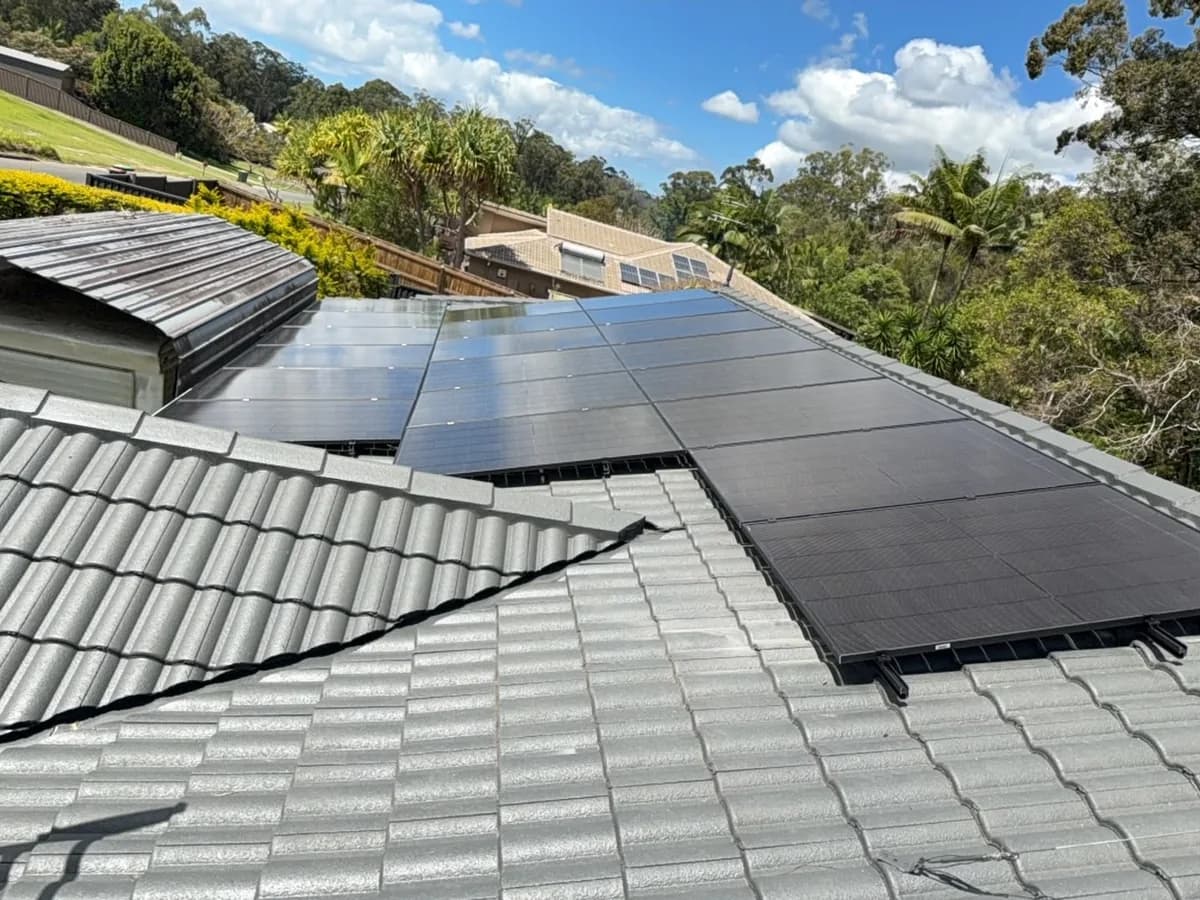 Black solar panels on a tiled roof in Beerwah, backing onto the Sunshine Coast hinterland