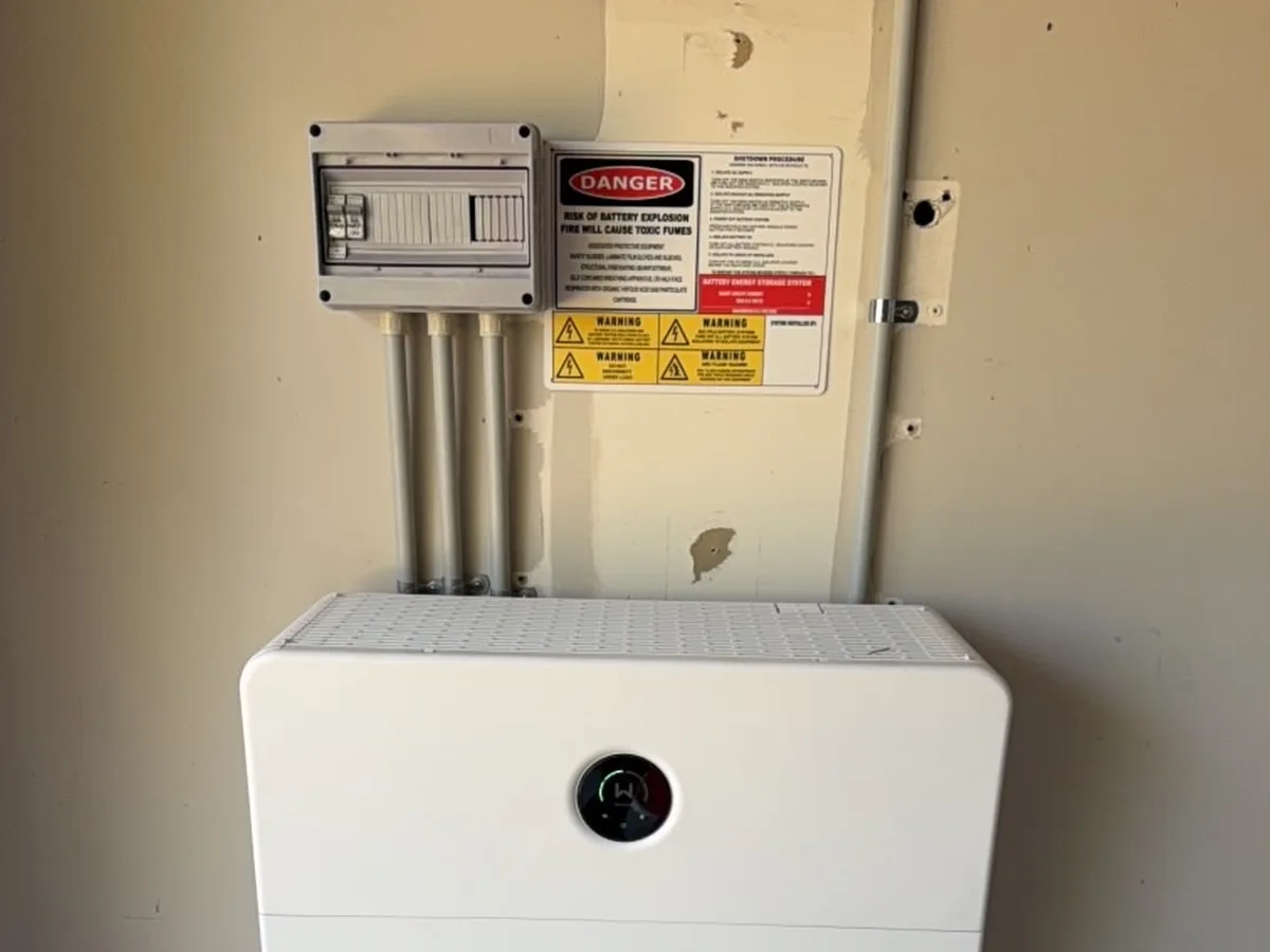 A home battery installed by EFS Solar in Currimundi, wired to the switchboard and shutdown isolator above