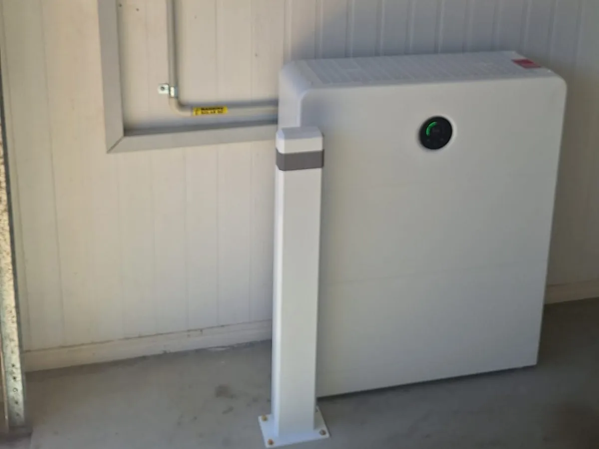 A home battery installed by EFS Solar in a Kawungan garage, wired to the switchboard and shutdown isolator